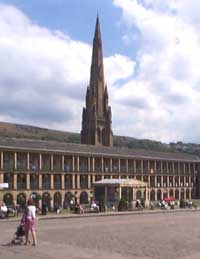 View of the Piece Hall courtyard with the spire of the former Square Chapel in the background